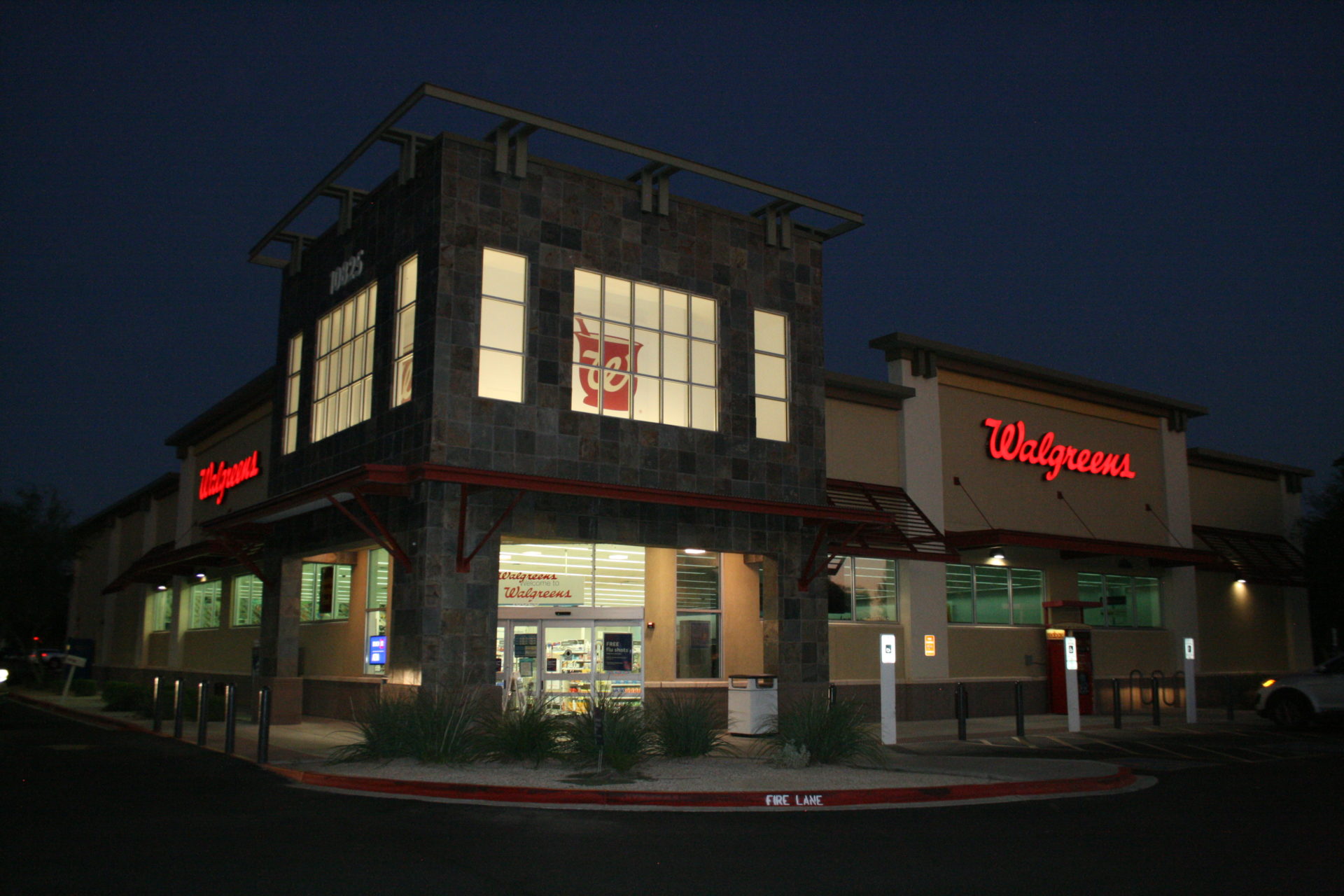 A large building with a red sign on the front.